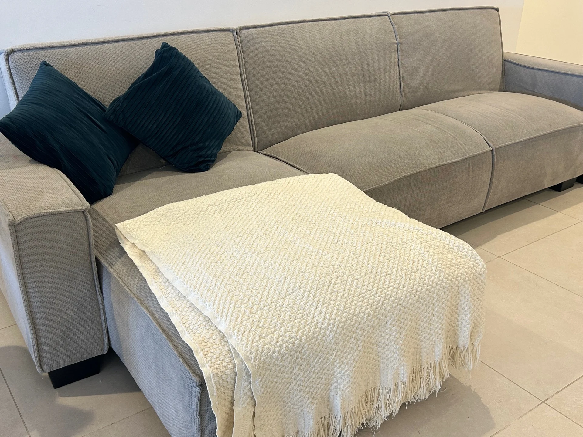 Sofa peninsula and sofa bed along with side table and lamp photo 1