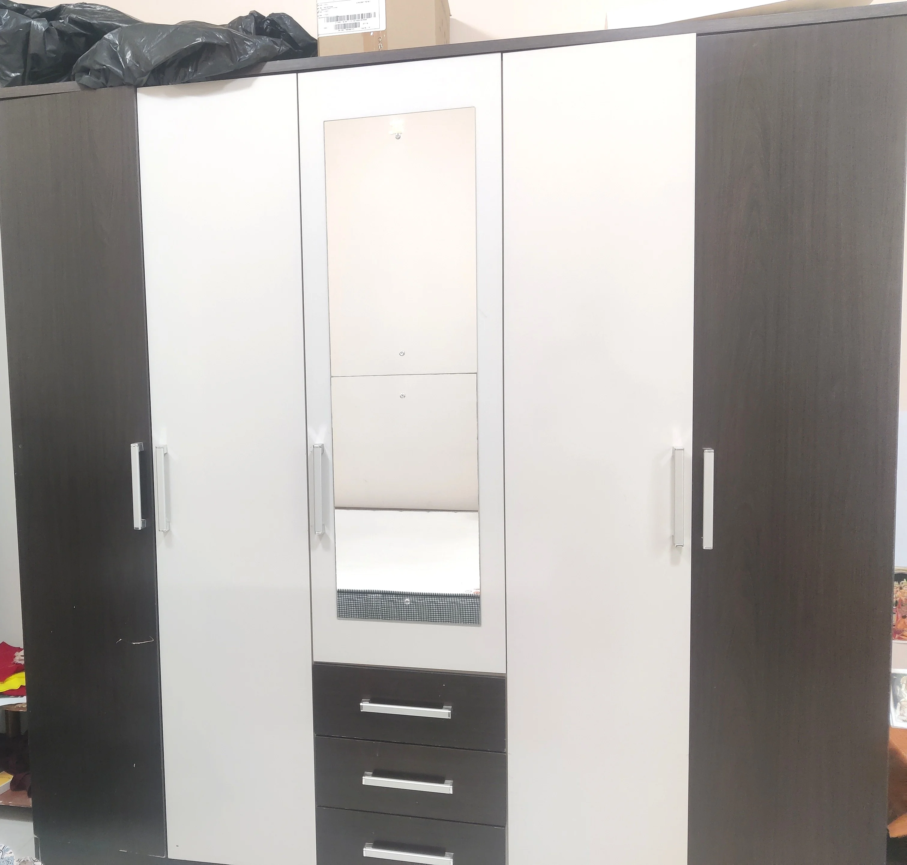Wardrobe, king size bed with Mattresses.